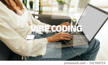 Vibe coding with laptop in a home setting during daytime Vibe coding with laptop in a home setting during daytime 142769724