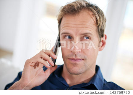 Thinking, businessman or phone call in house talking or speaking for planning, communication or chat. Ideas, news and thoughtful male entrepreneur with mobile in conversation to relax in remote work Thinking, businessman or phone call in house talking or speaking for planning, communication or chat. Ideas, news and thoughtful male entrepreneur with mobile in conversation to relax in remote work 142769750