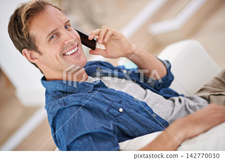 Portrait, happy man and phone call to relax in house for talking, speaking and communication. Smile, news and confident male person on mobile chat in conversation and discussion in home for break Portrait, happy man and phone call to relax in house for talking, speaking and communication. Smile, news and confident male person on mobile chat in conversation and discussion in home for break 142770030