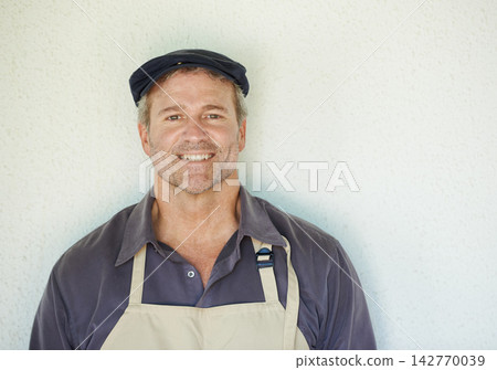 Portrait, man and happy cafe owner on wall background with small business startup manager on space. Face, entrepreneur and mature professional in apron at restaurant for sales career in Switzerland Portrait, man and happy cafe owner on wall background with small business startup manager on space. Face, entrepreneur and mature professional in apron at restaurant for sales career in Switzerland 142770039