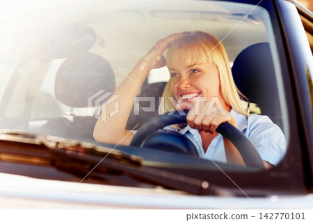 Driver, woman and happy in car windscreen on mirror for travel or tour in summer, road trip and relax with adventure. Female person, vehicle and smile on journey for holiday or vacation in lens flare Driver, woman and happy in car windscreen on mirror for travel or tour in summer, road trip and relax with adventure. Female person, vehicle and smile on journey for holiday or vacation in lens flare 142770101