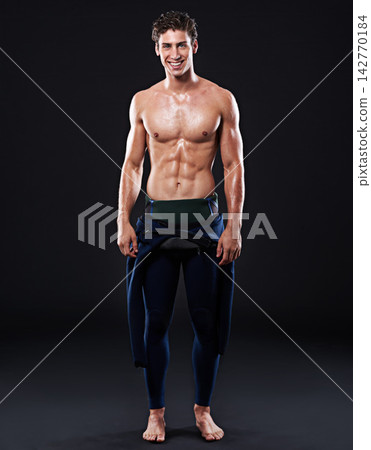 Studio background, portrait of surfer or smile for sports, fitness and training for competition event. Professional athlete, male person or model and man with body, muscle or abs with pride 142770184