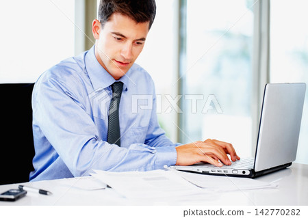 Businessman, accountant and laptop or notes for financial paperwork or investment report, review or office desk. Male person, document and growth proposal with corporate, research or stock market 142770282