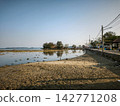 Sandy island shoreline view at low tide 142771208