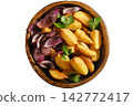 Bowl of roasted potatoes and red onions with herbs on wooden table 142772417