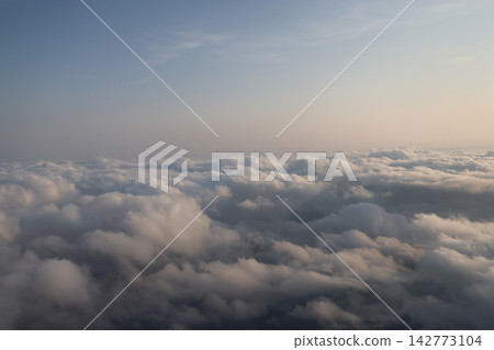 Soft clouds illuminated by gentle sunlight Soft clouds illuminated by gentle sunlight 142773104