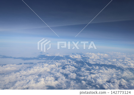 Aerial clouds revealing mountains below Aerial clouds revealing mountains below 142773124