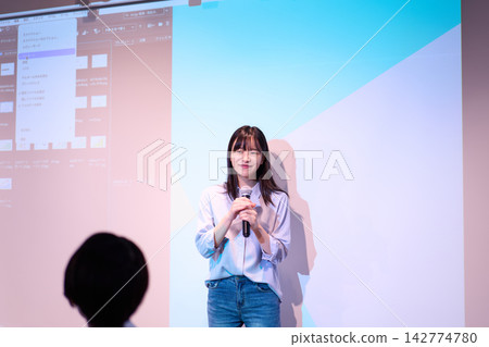 A woman presenting A woman presenting 142774780