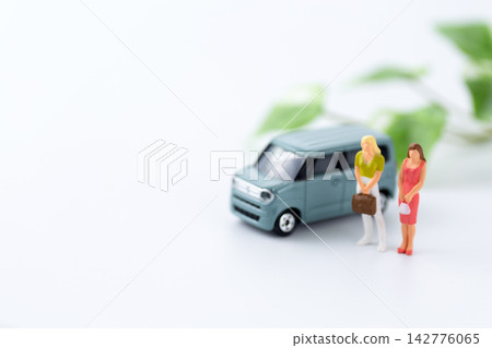 A car and a young woman doll A car and a young woman doll 142776065