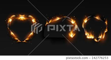 Dark paper with burnt edges forming various shapes and glowing with fire sparks Dark paper with burnt edges forming various shapes and glowing with fire sparks 142776253