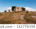 ruins of a house in La Mussara ,Tarragona, Spain, above everything on a hill with a cliff 142776398