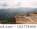 La Mussara cliff, Tarragona, overlooking other wooded mountains, summer 142776400