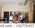 Chefs preparing food in restaurant kitchen during cooking course 142776407