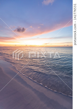Dreamy pastel dusk soft glowing sky calm tropical sea gentle rippled shore warm horizon minimal seascape. Perfect summer travel vacation sunset holiday. Exotic honeymoon getaway paradise coast Dreamy pastel dusk soft glowing sky calm tropical sea gentle rippled shore warm horizon minimal seascape. Perfect summer travel vacation sunset holiday. Exotic honeymoon getaway paradise coast 142776531
