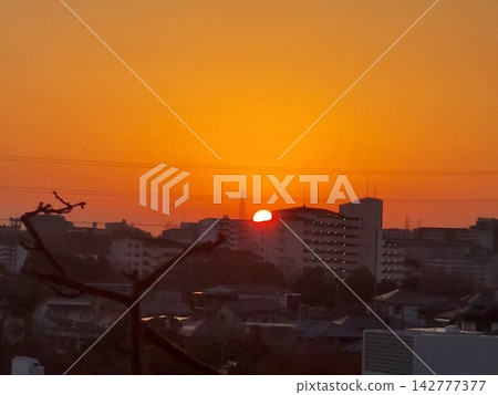 Sunset viewed from the top floor of an apartment building Sunset viewed from the top floor of an apartment building 142777377