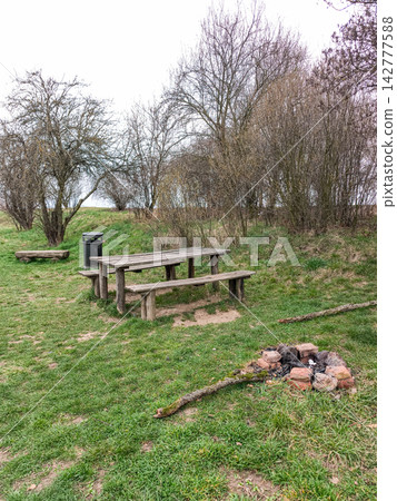 Resting place with wooden table, benches and fireplace in brandys nad labem stara boleslav Resting place with wooden table, benches and fireplace in brandys nad labem stara boleslav 142777588
