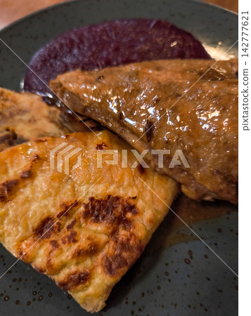 Roasted duck leg with potato pancakes and beetroot puree, traditional czech cuisine Roasted duck leg with potato pancakes and beetroot puree, traditional czech cuisine 142777621