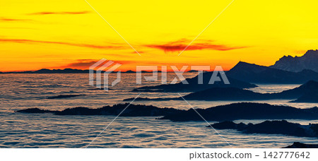 sunset over the sea sunset over the sea 142777642