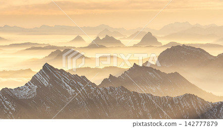 mountains in fog at sunset mountains in fog at sunset 142777879