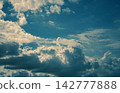 Fantastical clouds and a clear sky 142777888