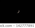 A beautiful crescent moon in the night sky 142777891