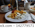 Hotel Breakfast Plate with Scrambled Eggs, Cottage Cheese, and Coffee 142779571