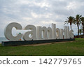 Cambrils, Spain, August 27 2017: Large Cambrils city sign at the promenade with palm trees 142779765