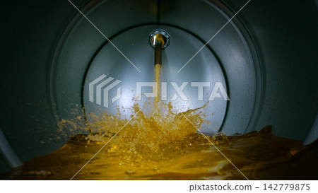 Gasoline Flowing and Splashing inside a Barrel, Unique Angle Shot from inside the Container 142779875