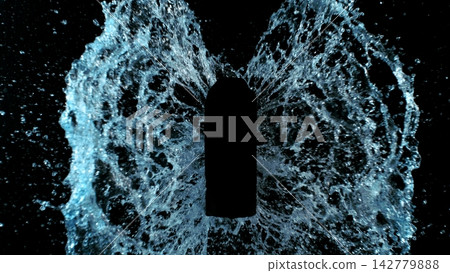 Freeze Motion of Splashing Water on Black Bottle Shape Isolated on Black Background Freeze Motion of Splashing Water on Black Bottle Shape Isolated on Black Background 142779888