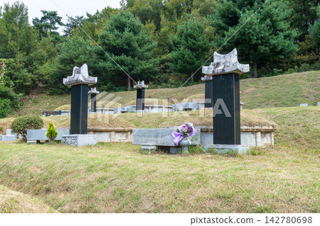 Tidied Korean traditional ancestral graves on a hill after weeding for Chuseok holiday Tidied Korean traditional ancestral graves on a hill after weeding for Chuseok holiday 142780698