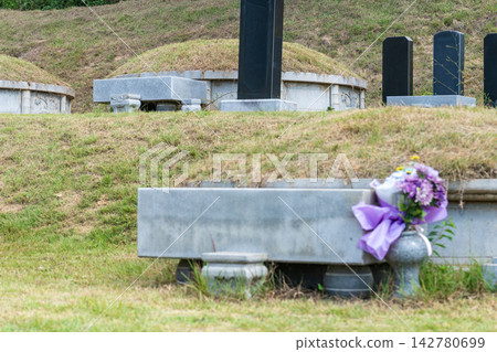 Tidied Korean traditional ancestral graves on a hill after weeding for Chuseok holiday 142780699