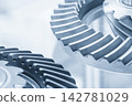 Close up of differential gear parts in a light blue scene 142781029