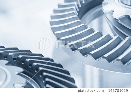 Close up of differential gear parts in a light blue scene Close up of differential gear parts in a light blue scene 142781029