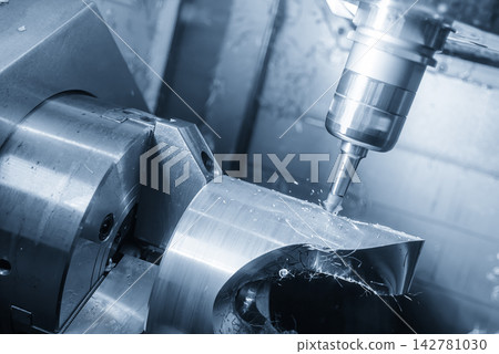 Chamfering process on automotive parts using a chamfer tool on a multi-tasking CNC machine in blue tone Chamfering process on automotive parts using a chamfer tool on a multi-tasking CNC machine in blue tone 142781030