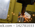 Burning metal chip from a rough cutting process on a CNC milling machine due to tool wear 142781033