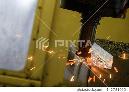 Burning metal chip from a rough cutting process on a CNC milling machine due to tool wear Burning metal chip from a rough cutting process on a CNC milling machine due to tool wear 142781033