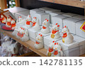 A row of fox fortune slips and figurines 142781135