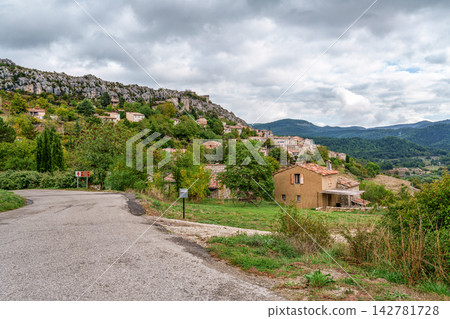 Cluster of houses forming the medieval village of Trigance with its castle on a rocky cliff in Provence, France Cluster of houses forming the medieval village of Trigance with its castle on a rocky cliff in Provence, France 142781728