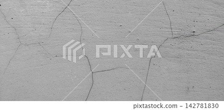Weathered gray concrete wall with intricate cracks Weathered gray concrete wall with intricate cracks 142781830