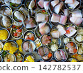 Aerial view variety of fresh Dim sum menu for steaming. Top view of raw food before cooking 142782537
