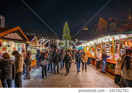 A giant Christmas tree and lively atmosphere at the Christmas market in Place Kléber, Strasbourg, France A giant Christmas tree and lively atmosphere at the Christmas market in Place Kléber, Strasbourg, France 142782761