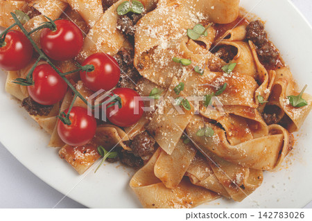 pappardelle pasta with bolognese sauce, topped with parmesan cheese and cherry branch, homemade, no people, pappardelle pasta with bolognese sauce, topped with parmesan cheese and cherry branch, homemade, no people, 142783026