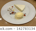 Cake and ice cream served on a white plate 142783134