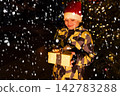 cute little boy hide behind present pile celebrate new year wear 142783288