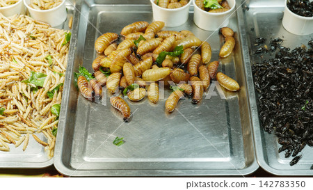 Exotic Street Food Display At Night Market, Edible Insects For Sale And Asian Market Food Concept Exotic Street Food Display At Night Market, Edible Insects For Sale And Asian Market Food Concept 142783350