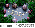 New Year background with 2027 on a blue background with Christmas decorations. 142785353