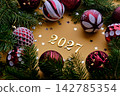 Yellow New Year's background with the number of the coming year 2027. 142785354