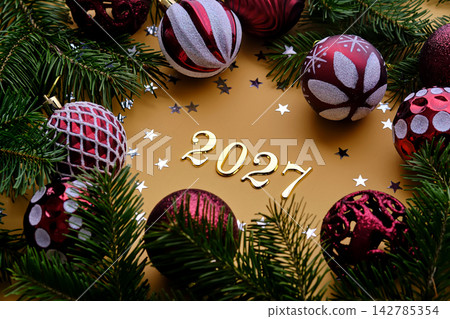 Yellow New Year's background with the number of the coming year 2027. Yellow New Year's background with the number of the coming year 2027. 142785354