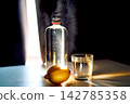 Refreshing water bottle glass and lemon for hydration 142785358