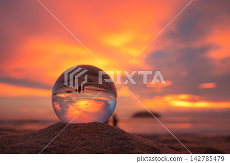 view of beautiful nature at the beach inside crystal ball. view of beautiful nature at the beach inside crystal ball. 142785479